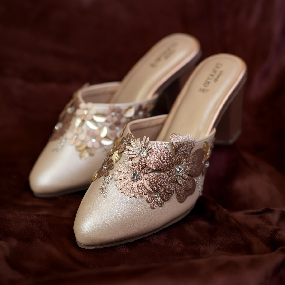 Pair of champagne floral mules for wedding and festive wear with pastel 3D flower design