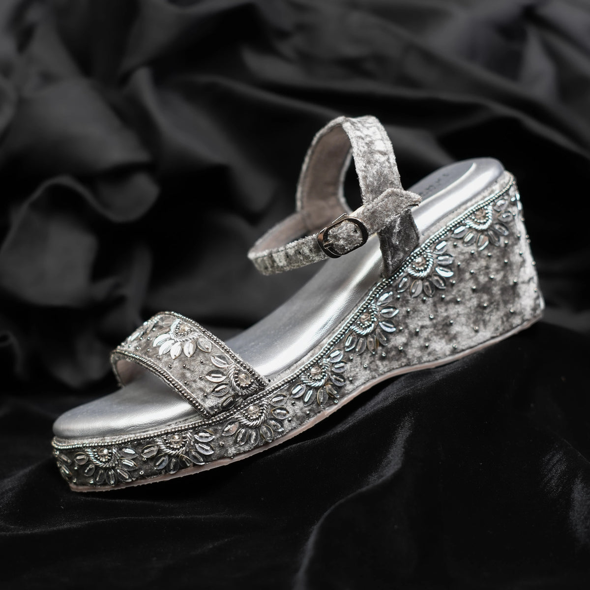 Silver embellished sandals with floral detailing on velvet base with ankle strap