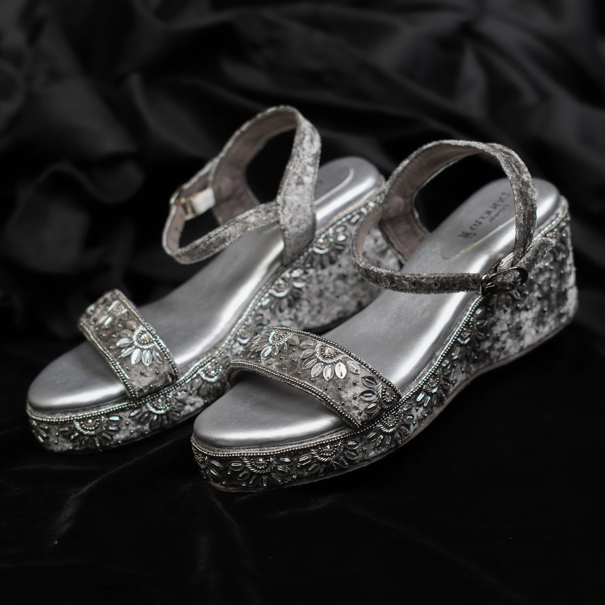 Metallic silver floral embroidered sandals with ankle straps