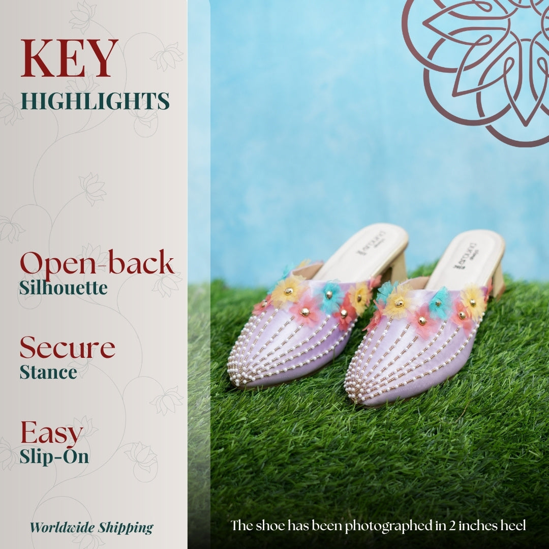 Lavender pointed heel with pastel floral appliqués, pearl detailing, open back design, and low cushioned heel