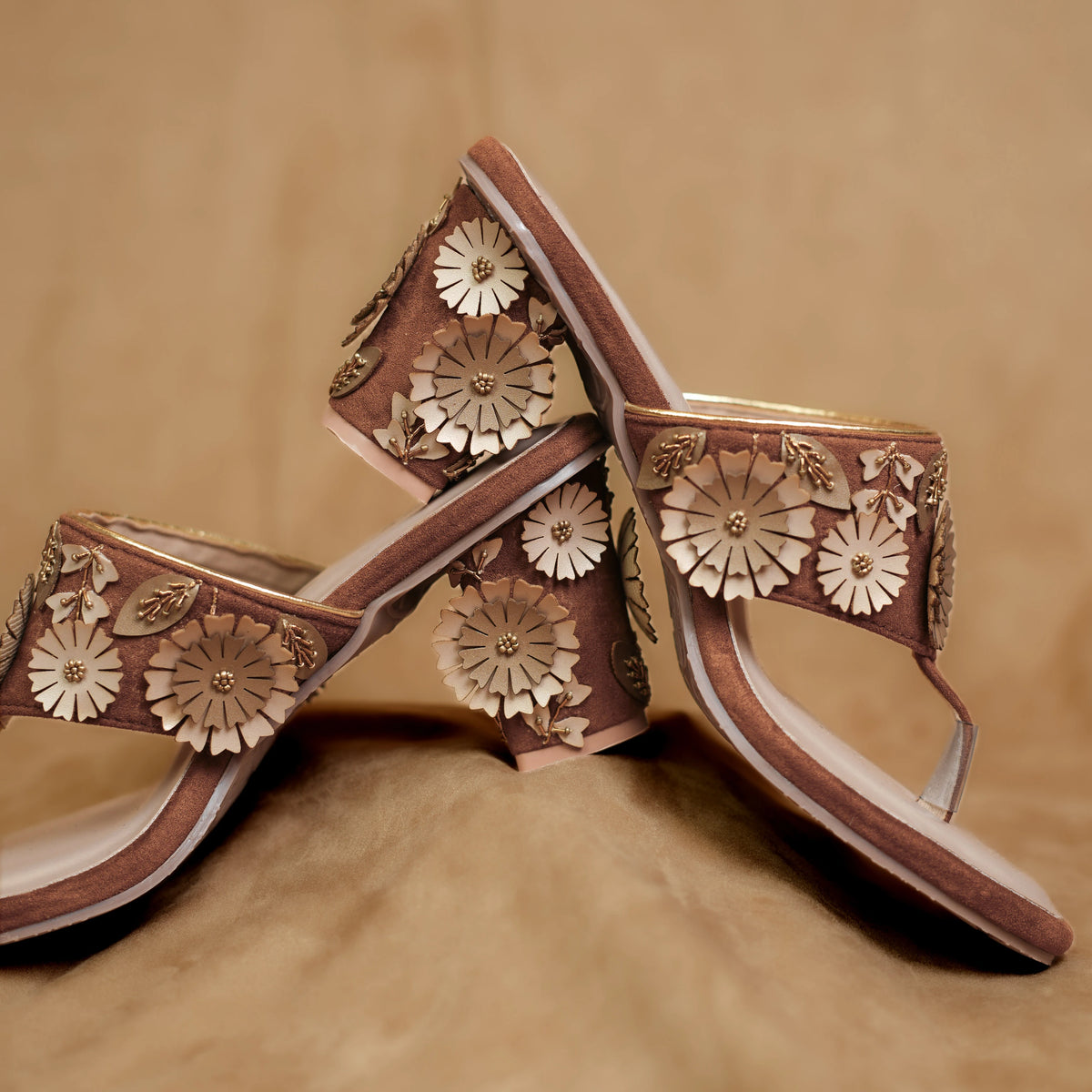 Brown toe-post sandal with floral appliqué detailing