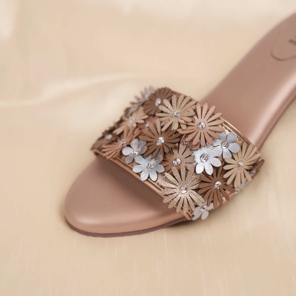Detail of Eden blush beige sandal floral strap and padded open toe footbed
