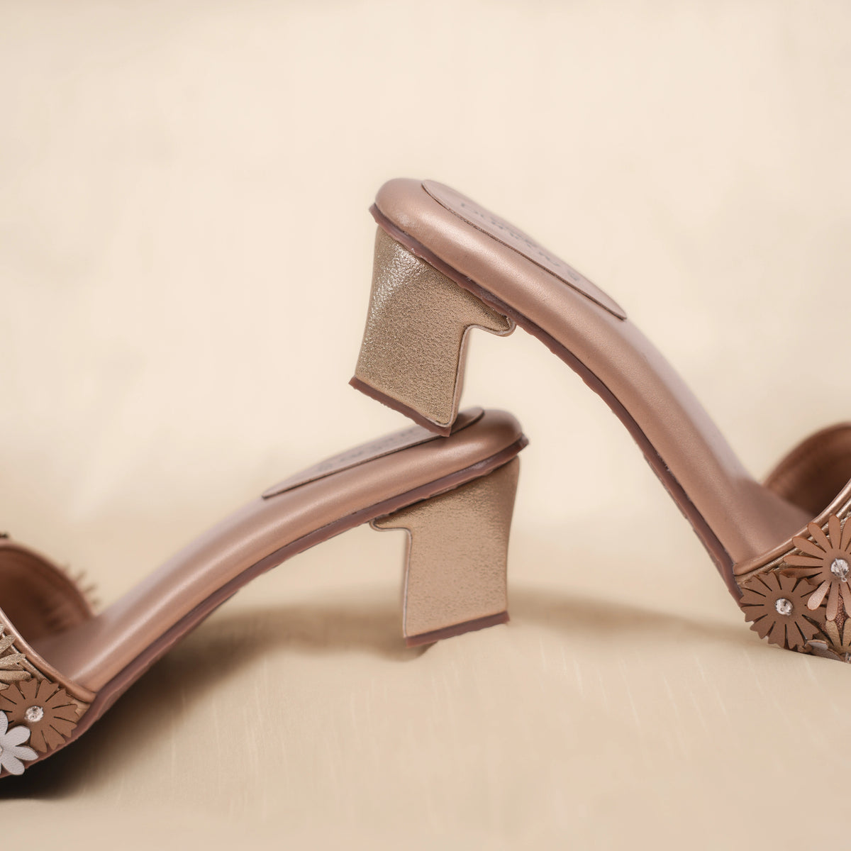 Eden sandals side profile showing shimmer gold block heel and blush beige sole
