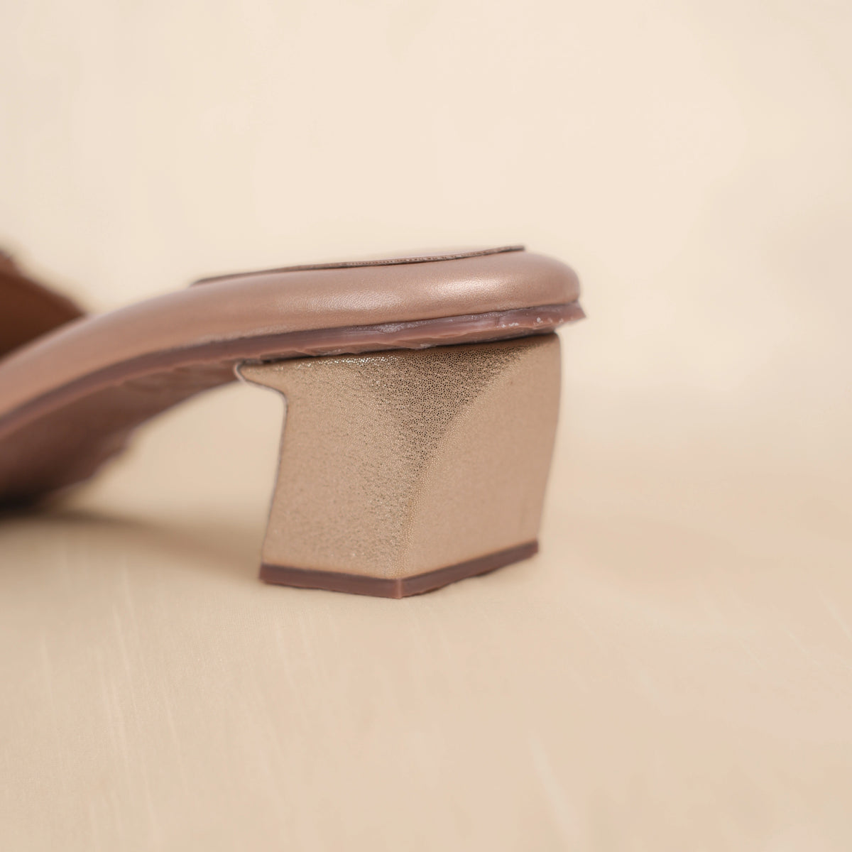 Eden sandal shimmer gold flared block heel detail, back view