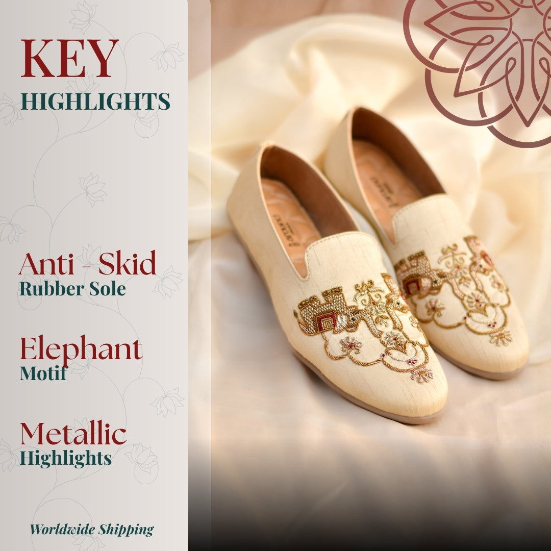 Beige ethnic slip ons with regal elephant embroidery and metallic thread detailing