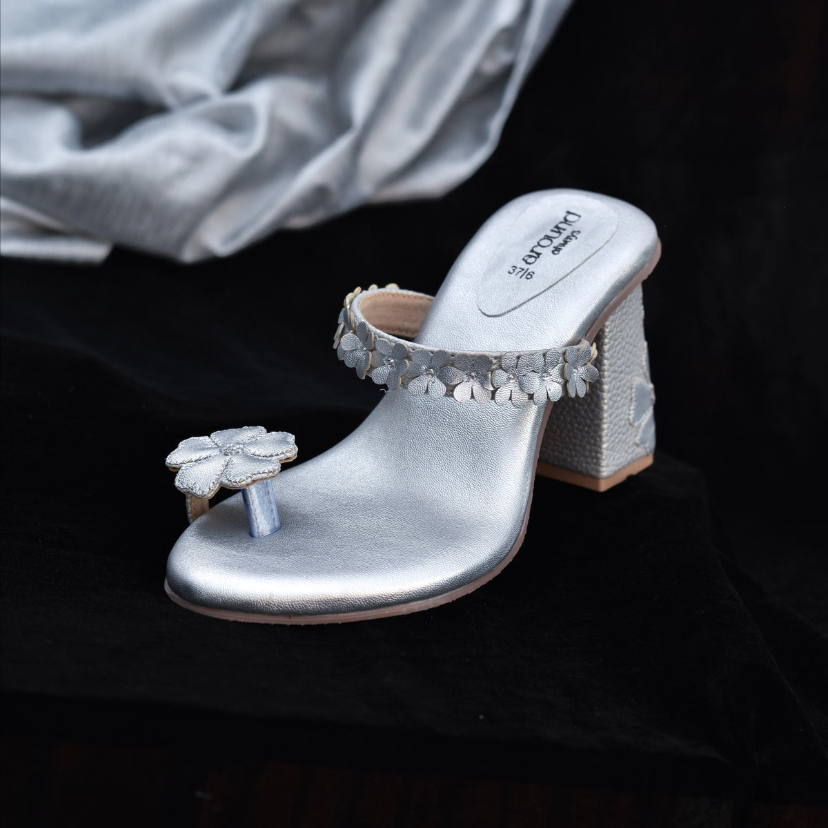 Metallic silver Kolhapuri sandals with statement 3D toe flower