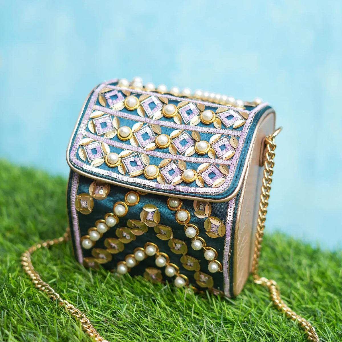 Indie bottle green hexa bag with pearls, gold sequin chevrons and mirror motifs