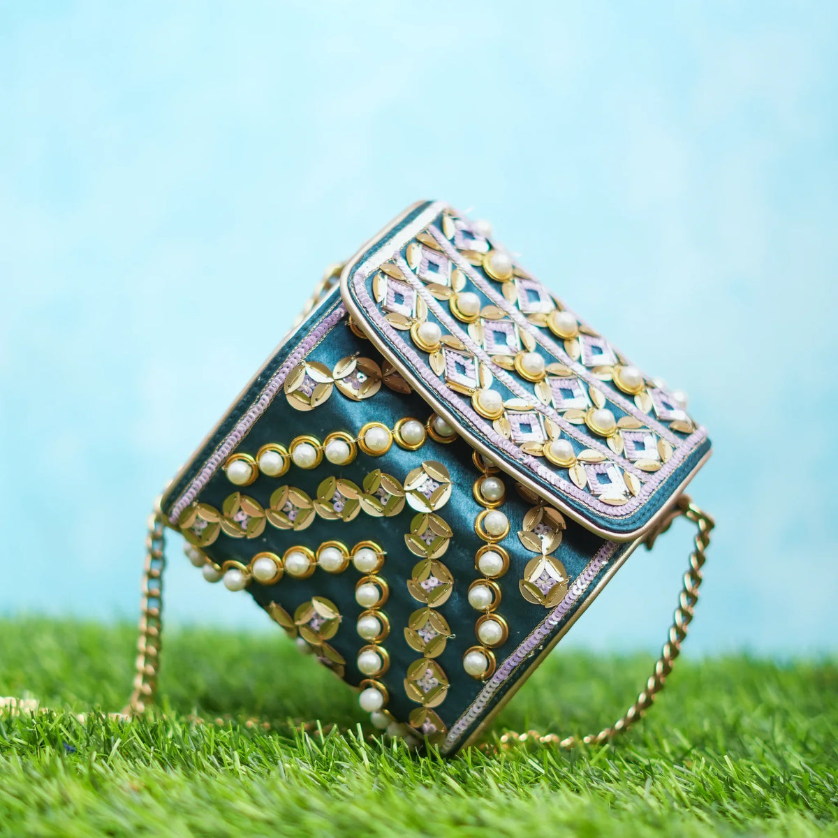Indie hexagon sling bag tilted to show the pearl and sequin front