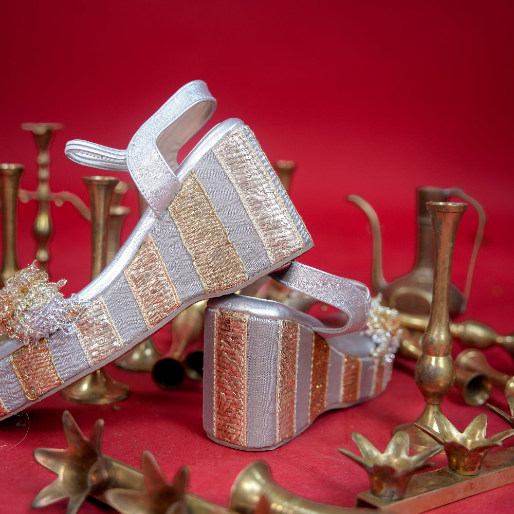 Silver festive wedge featuring layered metallic textile across the toe
