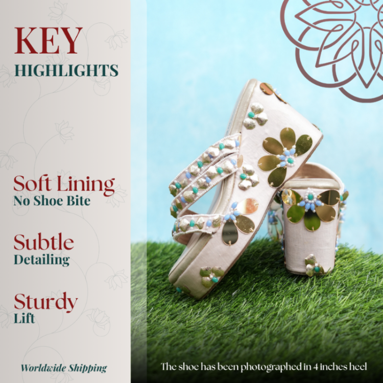 Platform heels with layered beaded straps and oversized floral detailing on the sole
