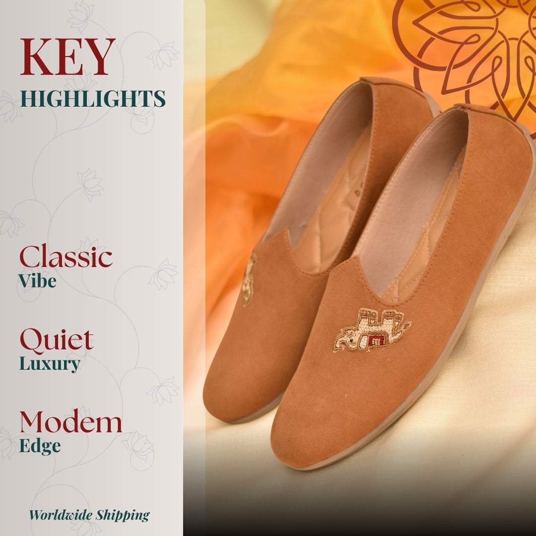 Rich tan ethnic flats featuring soft velvety texture and detailed elephant embroidery