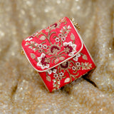 Naina red bridal box bag with gold zardozi vines and white flowers