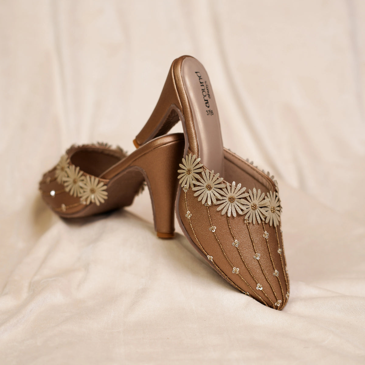 Pair of bronze party mules with ivory daisy trim and gold thread detailing