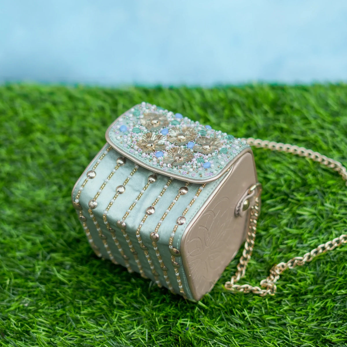 Mint floral box bag with gold bead lines, angled top view