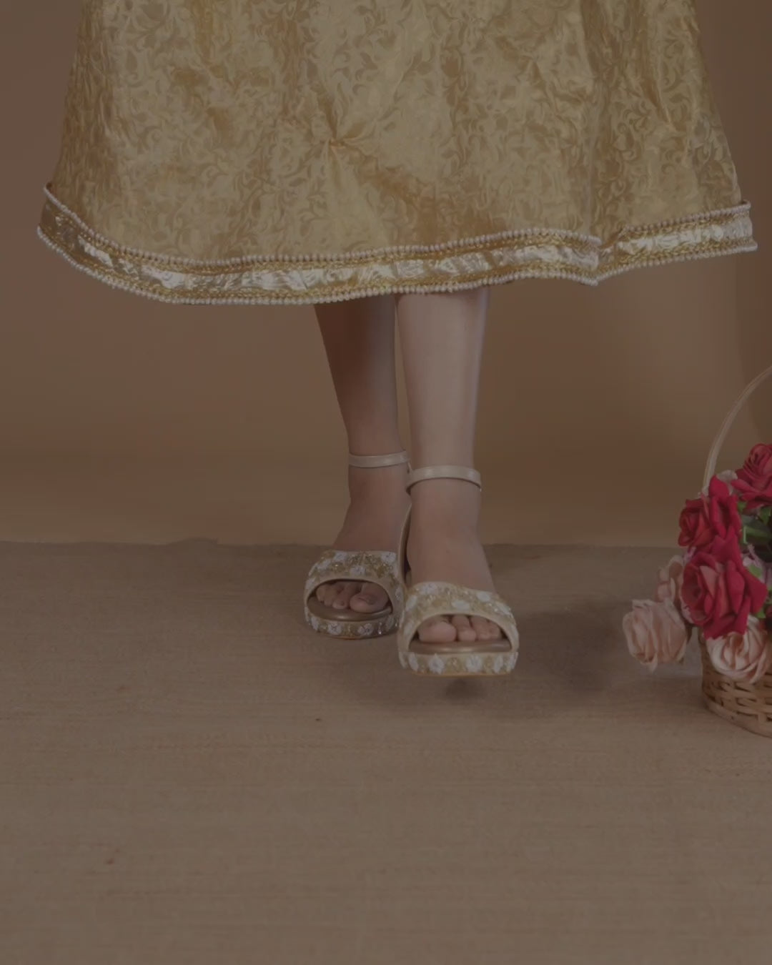 Golden wedding sandals with shiny pearl and bead embellishments and ankle strap