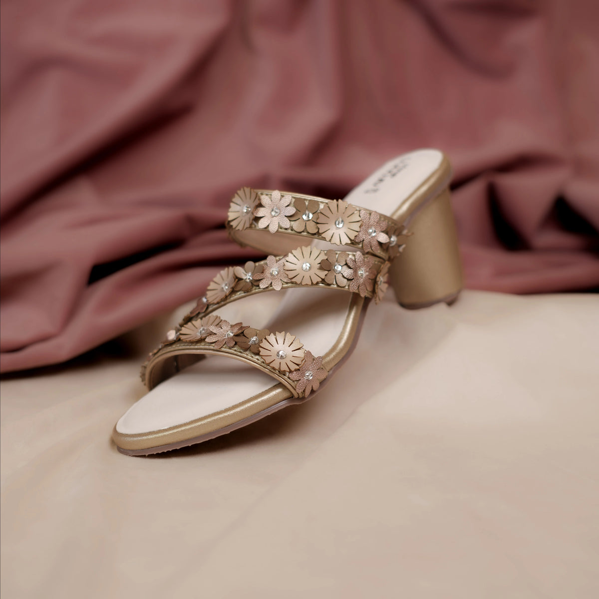 Radiance gold slide heels with three floral straps and round block heel by Around Always