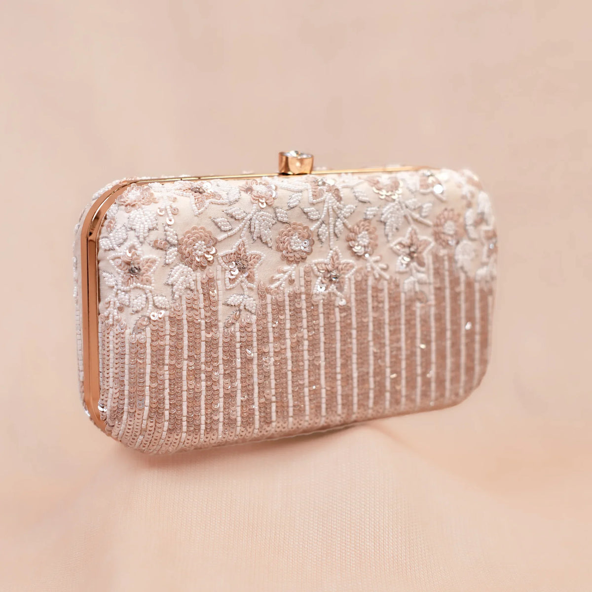 Savera ivory bridal clutch with hand embroidered white flowers and rose gold sequin stripes, front view