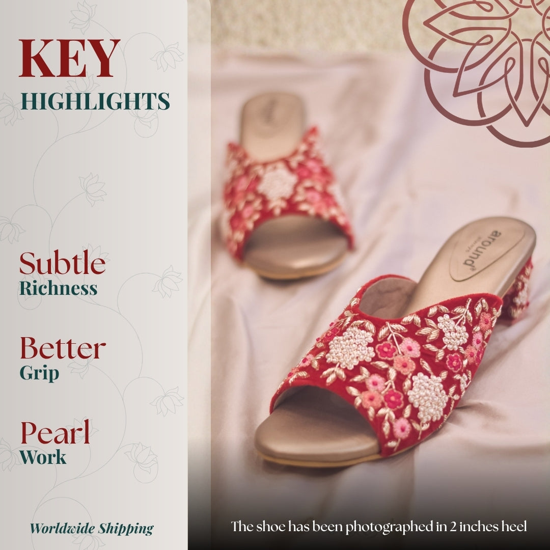 Festive red sandals with pearl flowers, gold accents, and comfortable bridal-ready support