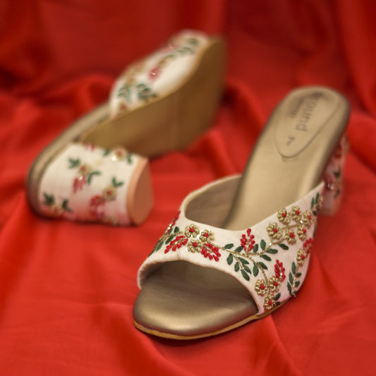 Golden sandals with red and green embroidery