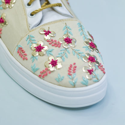 Thread and sequins embellishment on sneakers