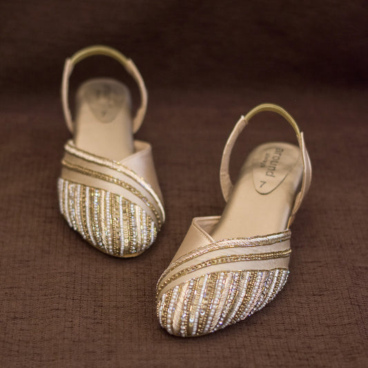 Golden closed toe sandals with ankle support