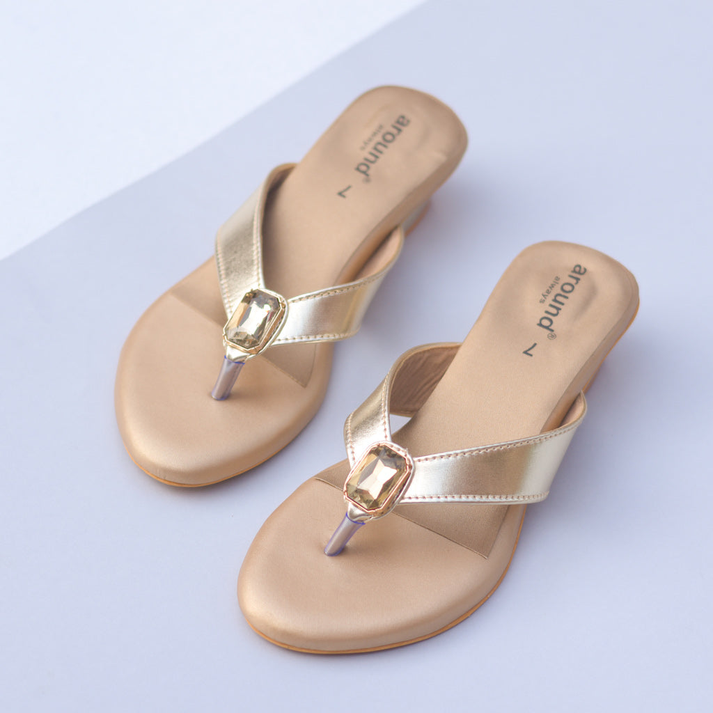Shiny golden sandals with stone