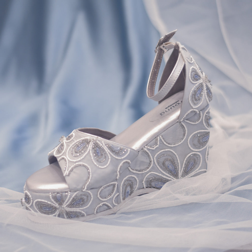 Silver high platform heels with ankle strap