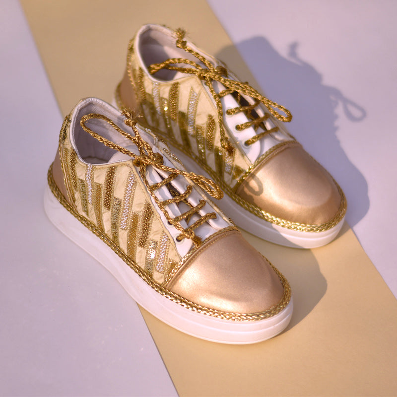 Shiny golden sneakers for brides and bridesmaids