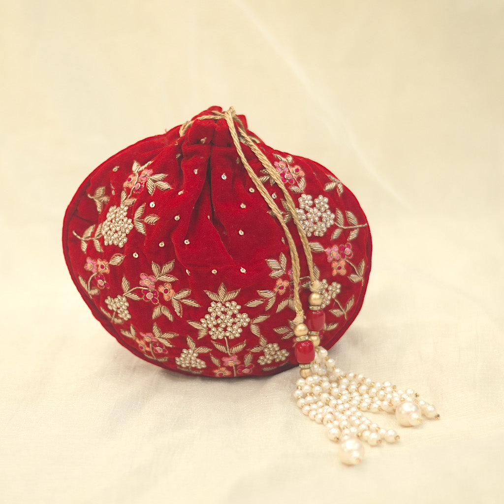 Red embellished royal potli for a premium look
